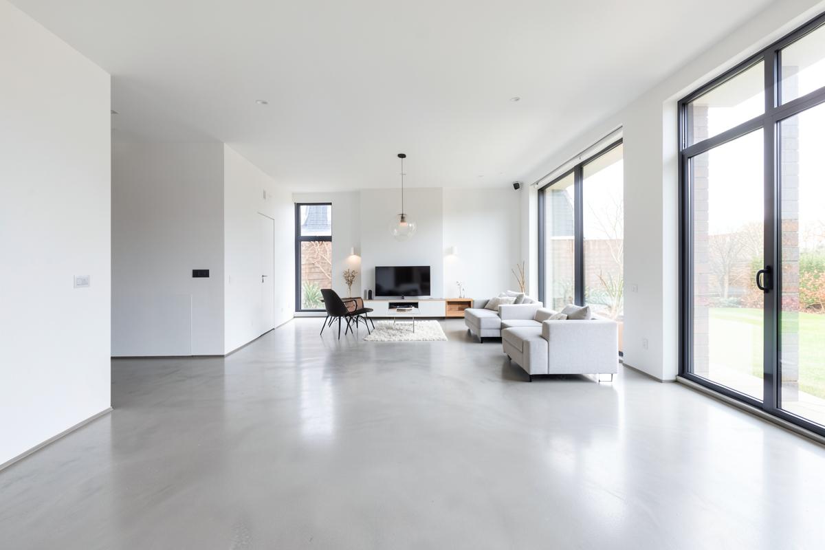 Bright renovated open-plan living space with polished concrete floor